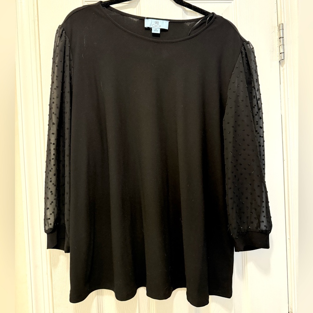 Black blouse with transparent polka dot sleeves